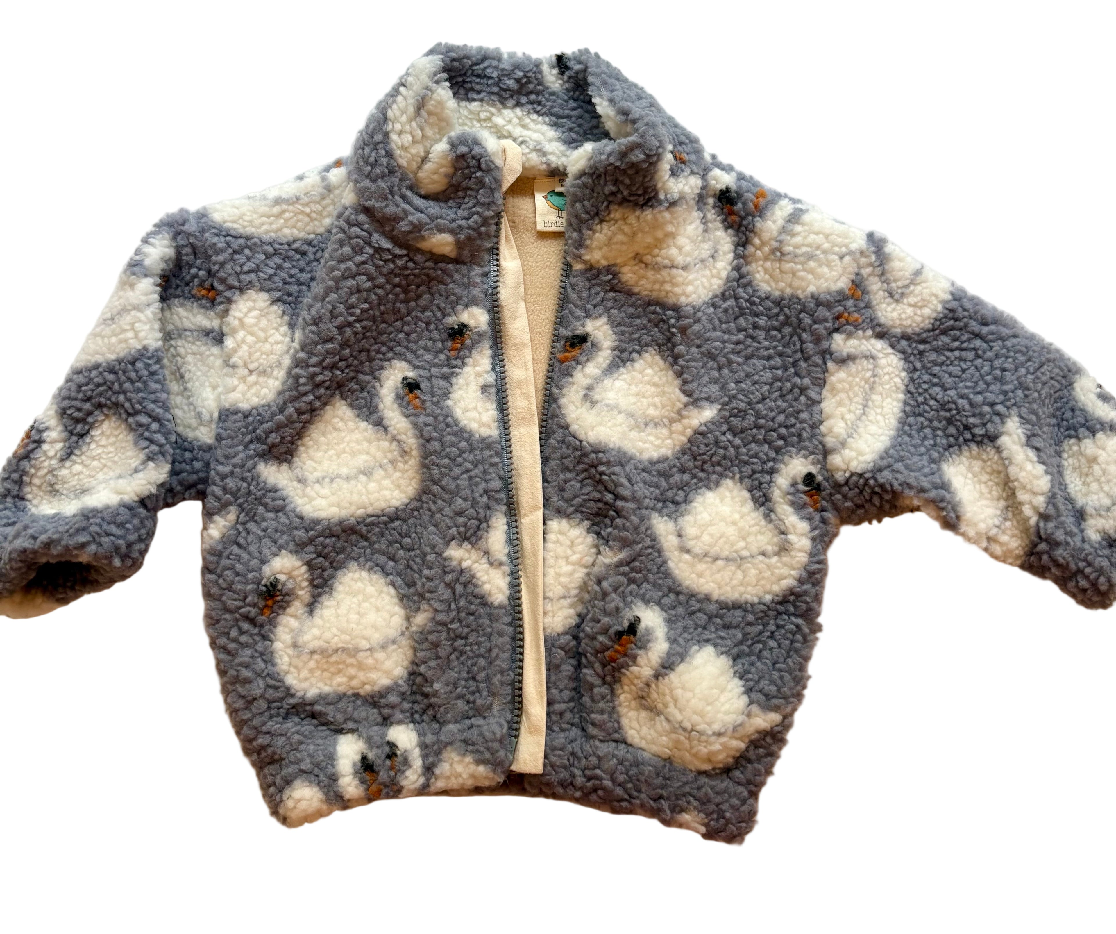 Children's fleece jacket with swan pattern on a light background